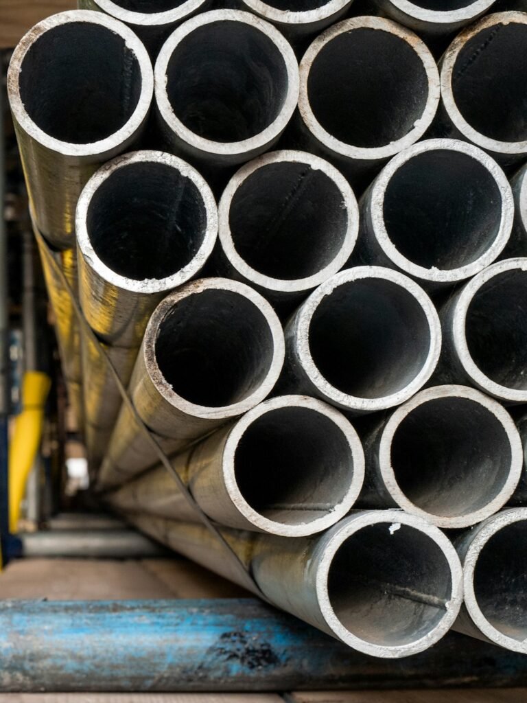 Stacked pipe illustration; not materials supplied to this project.